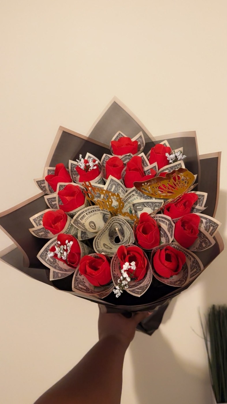 A money bouquet arranged with folded bills