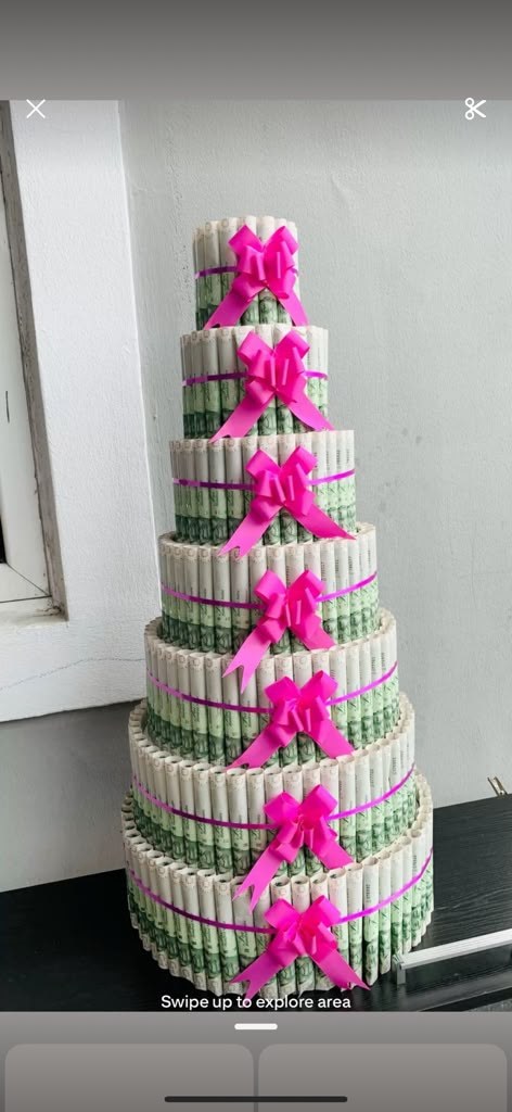 A money tower centerpiece built from rolled bills